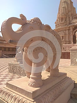 Stone carved elephant in Indian hindu Swaminarayan Temple photo
