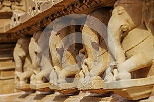 Stone carved erotic bas relief in Hindu temple in Khajuraho, India