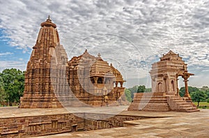 Stone carved erotic bas relief in Hindu temple in Khajuraho, India.