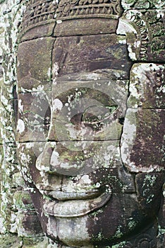 Stone carved face at the wall of the Bayon temple in Siem Reap, Cambodia.