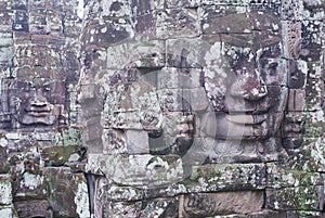 Stone carved faces at the wall of the Bayon temple in Siem Reap, Cambodia.