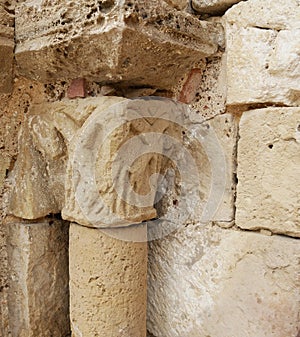 Stone carved ornament on a column at the entrance of the church in Payroux