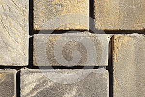 Stone carved in square shapes, work of a stonemasonry craftsman