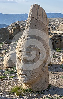 The stone carved statue of Antiochus on the western platform at the summit of Mt Nemrut in Turkiye.