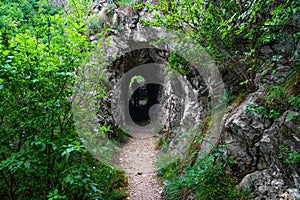 Stone carved tunnel in Nera Gorges Natural Park, Romania, Europe