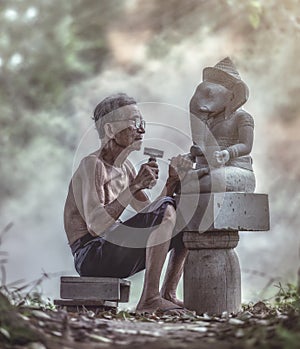 A stone carver at work photo