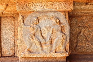 Stone carving of female dancing duo in the ancient ruins of hampi