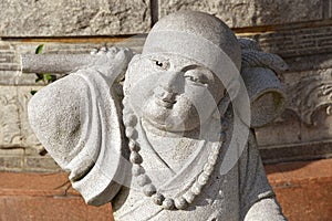 Stone carving of a little Buddha Meditation.