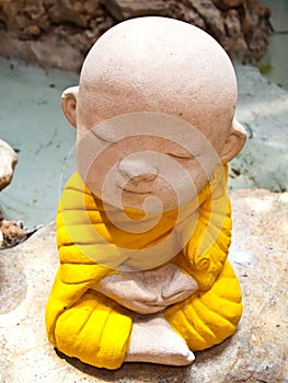 Stone carving of a little Buddha Meditation