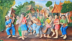 Stone carving and painting of traditional Thai musical instrument and Thai dance