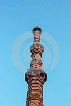 Stone carving tower and blue sky.