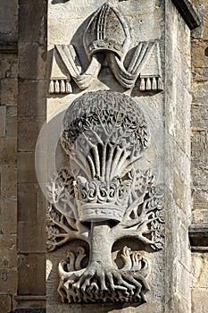Stone carving on the west front of Bath Abbey - a pictorial representation of Bishop Oliver King - in Bath, Somerset, UK