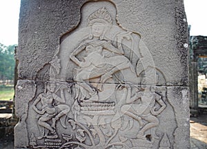 Stone carvings in Bayon, the most notable temple at Angkor Thom, Cambodia photo