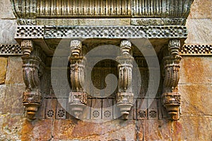 Stone carvings on outer wall of Jami Masjid Mosque, UNESCO protected Champaner - Pavagadh Archaeological Park, Gujarat, India.