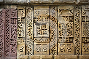 Stone carvings on outer wall of Jami Masjid , UNESCO protected Champaner - Pavagadh Archaeological Park, Gujarat, India