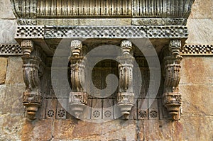 Stone carvings on outer wall of Jami Masjid , UNESCO protected Champaner - Pavagadh Archaeological Park, Gujarat, India