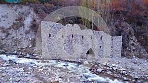 The stone castle on the banks of the river.