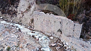 The stone castle on the banks of the river.