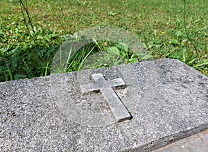 stone catholic christian cross at old cemetery in Ptuj. Slovenia