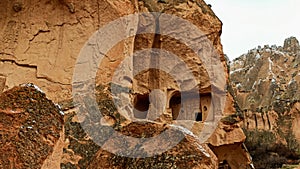 Stone cave houses and ancient monasteries with volcanic rock landscape at Zelve Valley in Cappadocia, Turkey