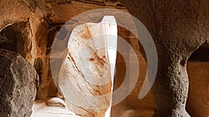 Stone cave houses and ancient monasteries with volcanic rock landscape at Zelve Valley in Cappadocia, Turkey