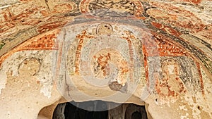 Stone cave houses and ancient monasteries with volcanic rock landscape at Zelve Valley in Cappadocia, Turkey