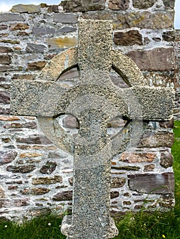Stone Celtic Cross with flat stone background
