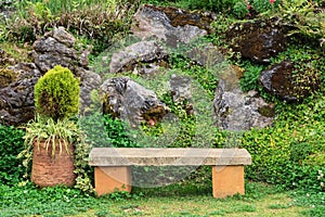 A stone chair in the park