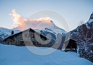 Stone chalet with the Matterhorn in the background, in the Swiss Alps