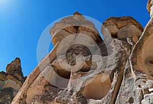 Stone chimneys with cave houses in Monks Valley, Cappadocia Turkey