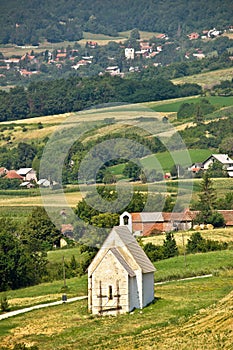 Stone church in green nature