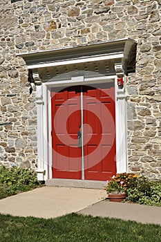 Stone church and red doors