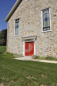 Stone church with red doors