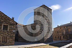 Stone church of San Ildefonso in Valverde de los Arroyos on a sunny day photo