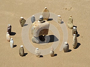 Stone circle on sandy beach