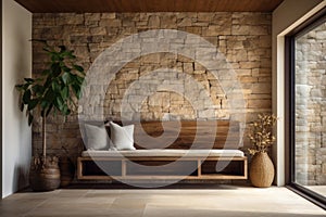 Stone cladding wall and bench with home decor in spacious hallway. Interior design of modern rustic entrance hall