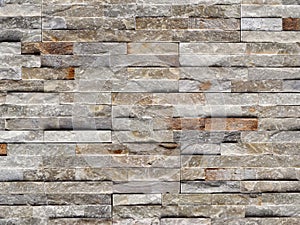 Stone cladding wall made of quartzite tiles, usually used for exterior but sometimes also for interiors .