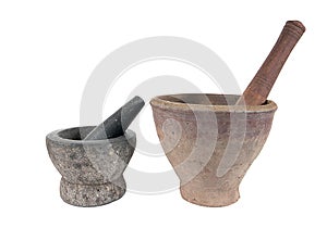Stone and clay mortar with wooden pestle isolated on white background
