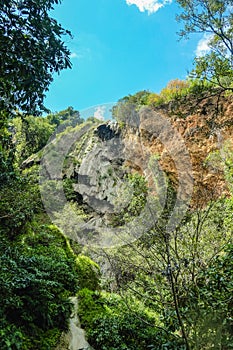 Stone cliff with blue sky in erawan waterfall natiaonal park