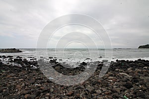 Stone coast. Stone coast on a cloudy summer day by the sea.