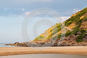 The stone coast of Vietnam. Large boulders on the beach.