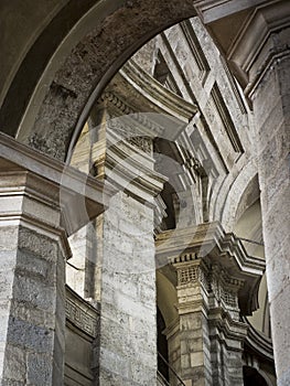 Stone Columns, Capitals, and Arches in an Old Milan Basilica