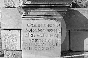 Stone columns written in ancient Greek in the open air museum of Turkey, Izmir, Ephesus. close up