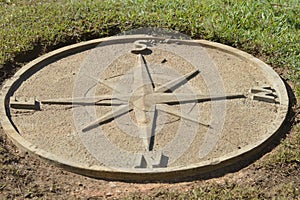 Stone compass at mountain