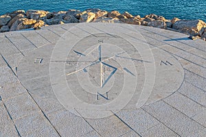 Stone compass by the sea