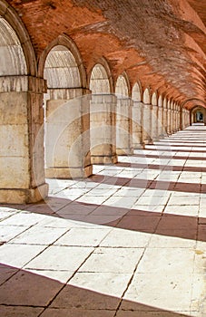 extensive stone corridor with lus rays coming in in the morning photo