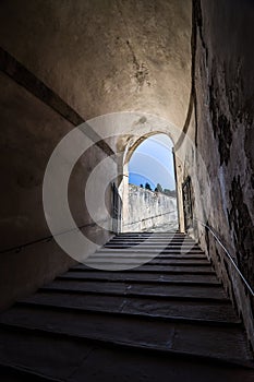 Stone corridor with stairway in Palazzo Pitti, Florence, Italy