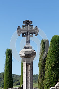 Stone corss in Catalan cemetery photo