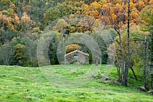 Stone country house for detachments in autumn landscape at sunset horizontal