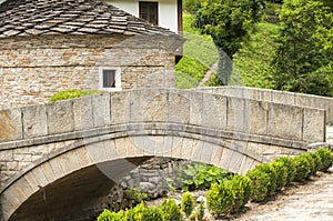 Stone countryhouse and stone bridge